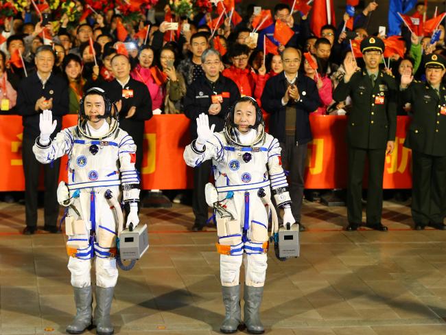 Chinese astronauts Jing Haipeng (R) and Chen Dong during a ceremony prior to launching Shenzhou 11 manned spacecraft at Jiuquan Satellite Launch Centre on October 17, 2016 in Jiuquan, China.