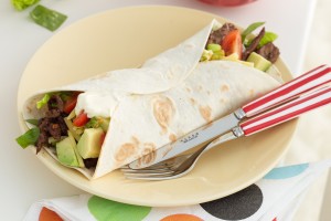 Steak fajitas with avocado and tomato salsa