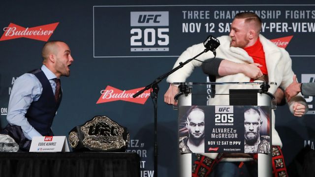 UFC president Dana White separates Conor McGregor and Eddie Alvarez during the UFC 205 press conference.