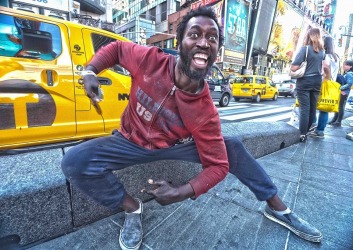 I met this man who was sitting sedately,when I first saw him in Times Square New York. However he came alive in front of ...