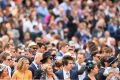  A big crowd watches on Stakes Day at Flemington.