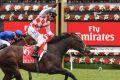 Awesome Rock wins the Emirates Stakes, and jockey Stephen Baster celebrates.