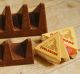 More valleys, fewer chocolate peaks: The old (rear) and new shape of Toblerone chocolate. 