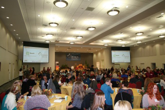 ALL TOGETHER NOW: Women business leaders, nonprofit organizers and members of the Asheville Area Chamber of Commerce gathered Thursday morning for the Chambr's inaugural WomanUP networking event and awards ceremony. Photo by Max Hunt