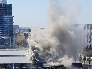Twitter user Matthew Hackling twiited a photo of a fire at Docklands. User Actions Follow Matthew Hackling ‏@mhackling Avoid #docklands #woolshedpub is on fire!