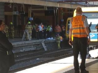 Woman under Flinders St train rescued