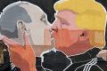 A mural on the walls of a bar in Vilnius, Lithuania, depicts Russian President Vladimir Putin and Republican ...