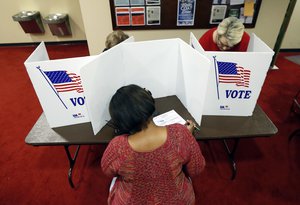 Last minute voters rush to cast their ballots at the Christ United Methodist Church precinct in north Jackson, Miss., Tuesday, Nov. 8, 2016.