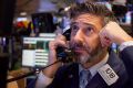 A trader on the floor of the New York Stock Exchange on Friday. US stocks fluctuated in whipsaw trading.