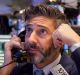 A trader on the floor of the New York Stock Exchange on Friday. US stocks fluctuated in whipsaw trading.