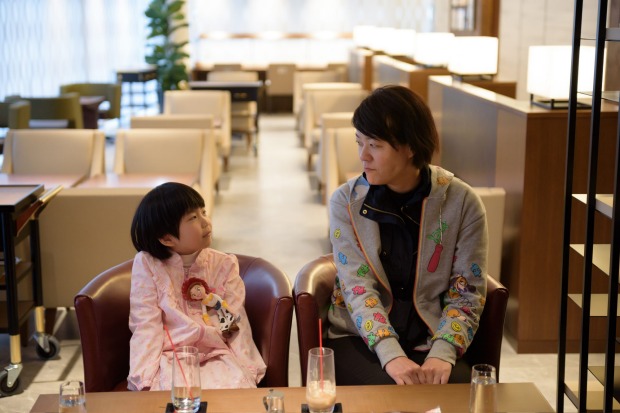 A woman and her daughter relax in the View Gold Lounge, operated by East Japan Railway Company and View Card, at Tokyo ...