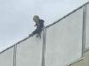 Baby balcony dangling police officer probe