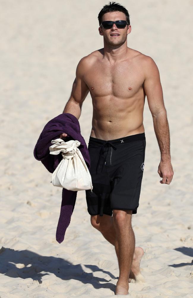 Scott Eastwood pictured going for a swim at Bondi Beach with friend Rhys. Picture: BackGrid