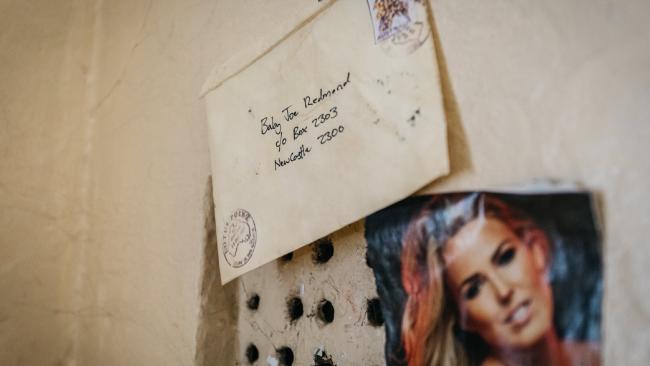 A letter is stuck to one of the cell walls addressed to Baby Joe Redmond in Newcastle. Picture: Tim Frawley for news.com.au