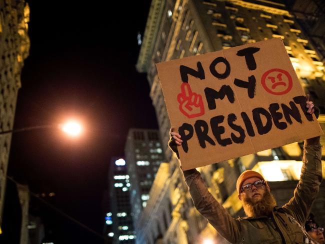 Anti-Donald Trump protesters march in the street on Fifth Avenue in New York City. Picture: Getty