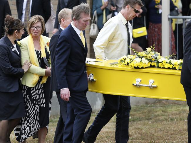 Rosie Batty (yellow jacket) attends her son Luke’s funeral. Picture: Photo David Caird. Luke Batty funeral service at Flinders Christian Community College Chapel. Mother Rosie follows the coffin after the service.