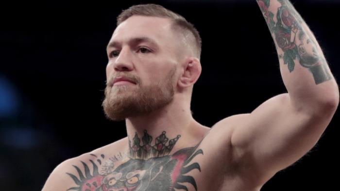 Conor McGregor gestures toward fans while working out ahead of his UFC 205 mixed martial arts bout against Eddie Alvarez during an open workout, Wednesday, Nov. 9, 2016, at Madison Square Garden in New York. McGregor will square off against Alvarez during their match on Saturday. (AP Photo/Julio Cortez)