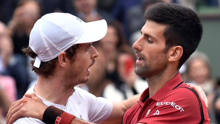 Serbia's Novak Djokovic (R) speaks with Britain's Andy Murray after winning the men's final match at the Roland Garros 2016 French Tennis Open in Paris on June 5, 2016. / AFP PHOTO / PHILIPPE LOPEZ