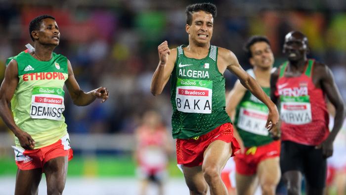 In this photo released by IOC, Algeria's Abdellatif Baka narrowly wins the gold ahead of Ethiopia's Tamiru Demisse in the men's 1,500-meter T13 final athletics event at Olympic Stadium during the Paralympic Games in Rio de Janeiro, Brazil, Sunday, Sept. 11, 2016. (Bob Martin/OIS,IOC via AP)