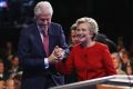 Hillary Clinton shakes hands with husband Bill Clinton after the Presidential Debate with Republican presidential ...
