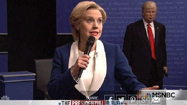 Alec Baldwin as Donald Trump lurks behind Kate McKinnon as Hillary Clinton. Picture: Supplied.