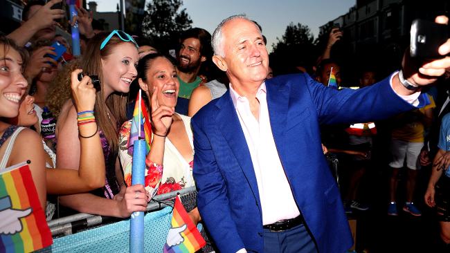 Prime Minister Malcolm Turnbull took lots of pictures with bystanders at the 2016 Mardi Gras parade in March.