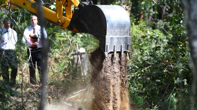 NSW Police and National Parks and Wildlife officers begin excavating the site in the Royal National Park. Picture: AAP Image/Dean Lewins).