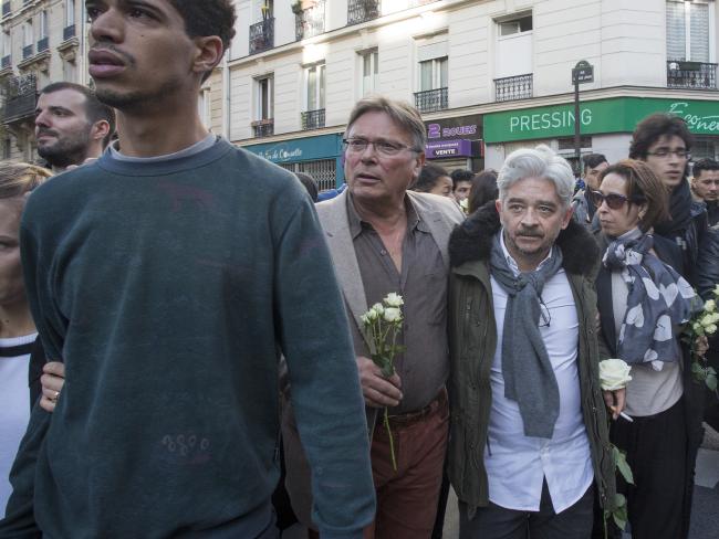 Cafe owner Gregory Reibenberg (white hair), lost his wife Djamila and two close friends in the attacks. Picture: Ella Pellegrini