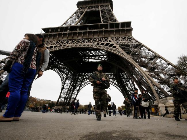 Soldiers patrol the Eiffel Tower, days after the attacks on Paris. Picture: AFP/Francois Guillot