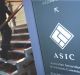 An ASIC staffer has been charged with money laundering offences.