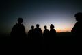 U.S. Army soldiers stand with Afghan policemen before a joint patrol of Qalanderkhail, outside of Bagram Air Field in ...