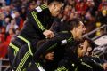 Mexico players celebrate the win.