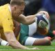 Reece Hodge scores Australia's first try against Scotland.