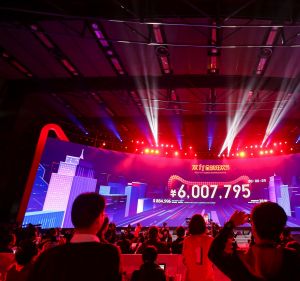 China's Singles Day online shopping festival just past midnight with a screen showing the transaction volume in Shenzhen ...