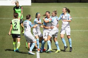 Laura Alleway of Melbourne United celebrates with her team after scoring.