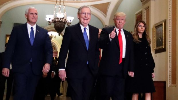 Vice president-elect Mike Pence, Senate Majority Leader Mitch McConnell, President-elect Donald Trump and his wife ...