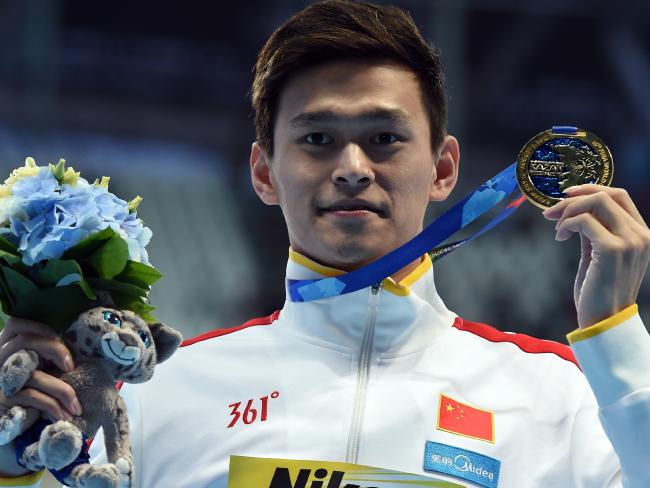 Sun Yang shows of his gold medal after winning the 800m freestyle final at last year’s world championships in Russia. He made a shock exit from his signature 1500m race just minutes before it was due to start.