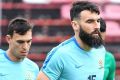 Skipper Mile Jedinak runs during a Socceroos training session in Bangkok.