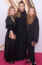 Elizabeth Olsen (centre) and Mary-Kate and Ashley attend Olsen the 2016 CFDA Fashion Awards. Picture: Jamie McCarthy/Getty Images/AFP