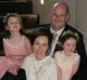 Melanie Swan and Scott Chamberlain on their wedding day with daughters Sophie and Emma. For news story