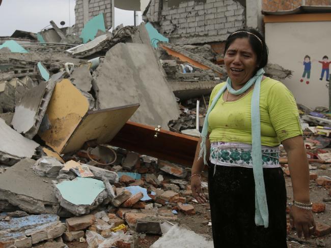 A woman cries as volunteers search for the body of her daughter amid the debris of a destroyed house in Pedernales, Ecuador. Picture: AP Photo/Dolores Ochoa