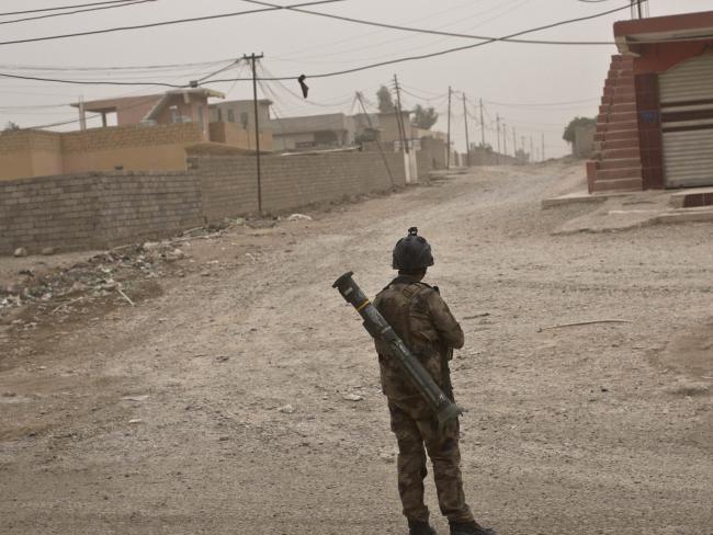 An Iraqi special forces soldier stands in a street in Gogjali, an eastern district of Mosul, Iraq. Picture: AP