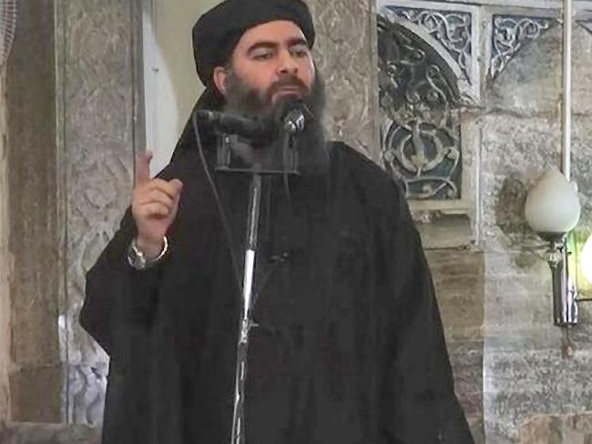 Islamic State leader Abu Bakr al-Baghdadi, giving a speech in an unknown location.