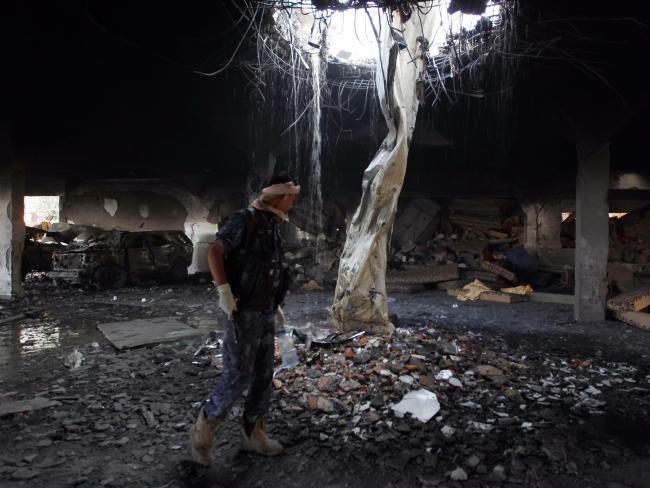 Saudi-led coalition planes hit a building in Sanaa where people had gathered to mourn the death of an official. Picture: AFP/Mohammed Huwais