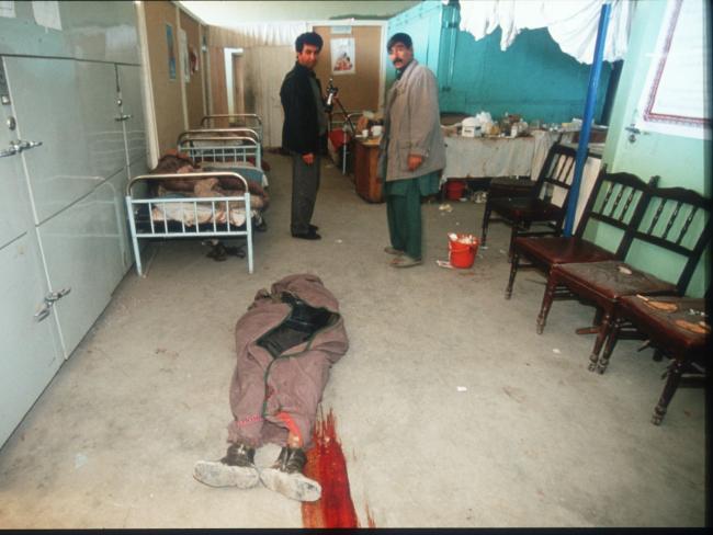 The body of a Dostum fighter lies on the floor in a hospital in 1994 in Kabul, Afghanistan. Picture: Robert Nickelsberg