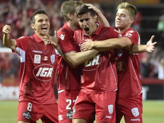 Sergio Guardiola of United celebrates his goal with team mates during the Round 6 A-League match between Adelaide United and Brisbane Roar FC at Hindmarsh Stadium in Adelaide, Friday, Nov. 11, 2016. (AAP Image/David Mariuz) NO ARCHIVING, EDITORIAL USE ONLY