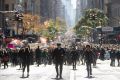 Demonstrators march up 5th Avenue in New York during a mass protest against the election of Donald Trump.