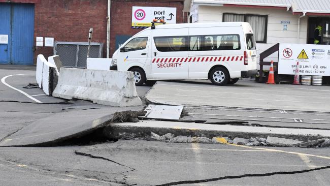 Fissures run along a road by the Centre Port in Wellington, Monday, November 14, 2016, after a major earthquake struck New Zealand's south Island early Monday.
