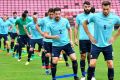 Acclimatising: Milos Degenek and Matthew Spiranovic warm up during a Socceroos training session at SCG Stadium in Bangkok.