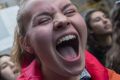 Ellen Marius, right, and Majo Orozco chant slogans as they demonstrate during a rally outside Trump Tower in New York.